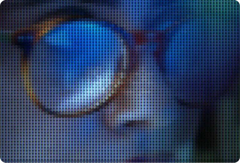 A close-up of glasses reflecting a screen